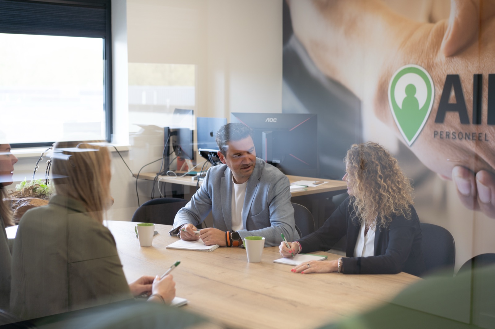 Intakegesprek bij de merkmuur